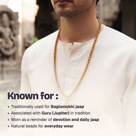 Man wearing the Haldi Jaap Mala over a cream kurta