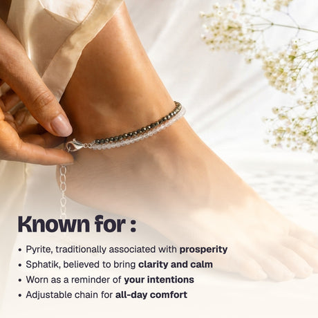 Woman fastening the pyrite and quartz anklet with its lobster clasp