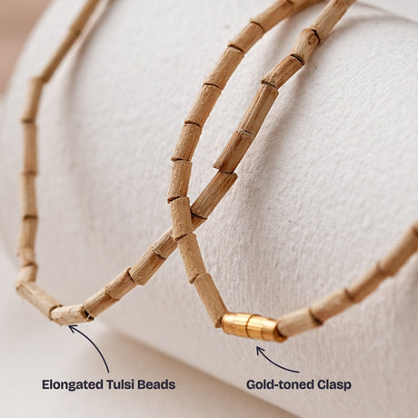 Close-up of the elongated Tulsi beads and the gold-toned clasp